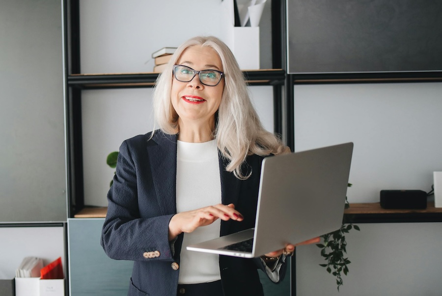 senior lady checking her EZY Drop Shipping profits on her laptop senior lady checking her EZY Drop Shipping profits on her laptop